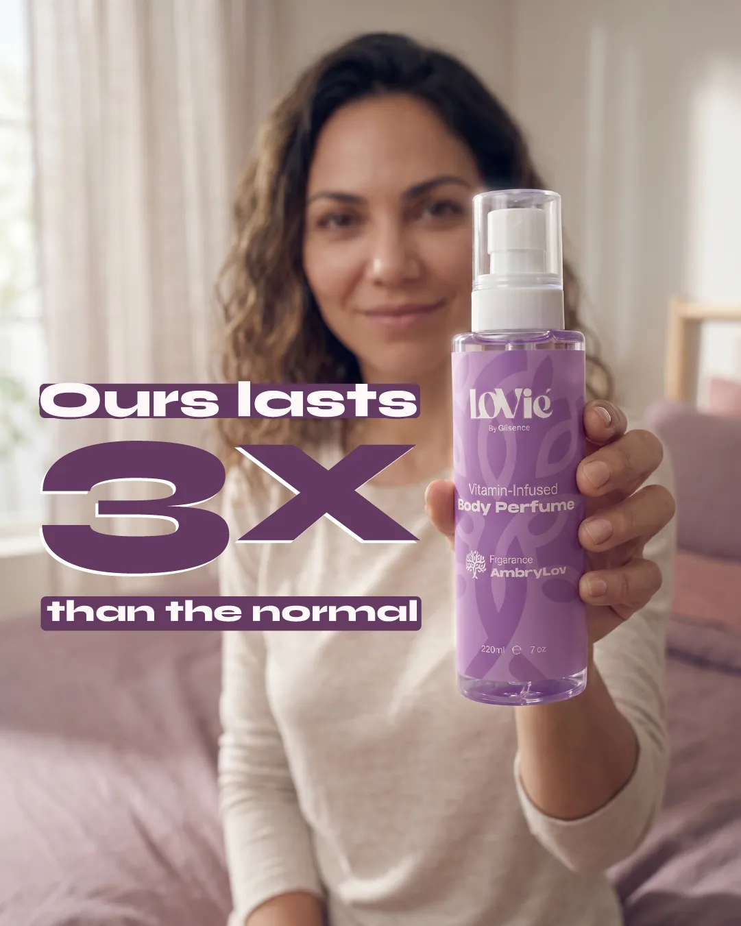 Portrait static: a woman holding up the violet AmbryLov body perfume, the line Ours lasts 3x than the normal beside it.