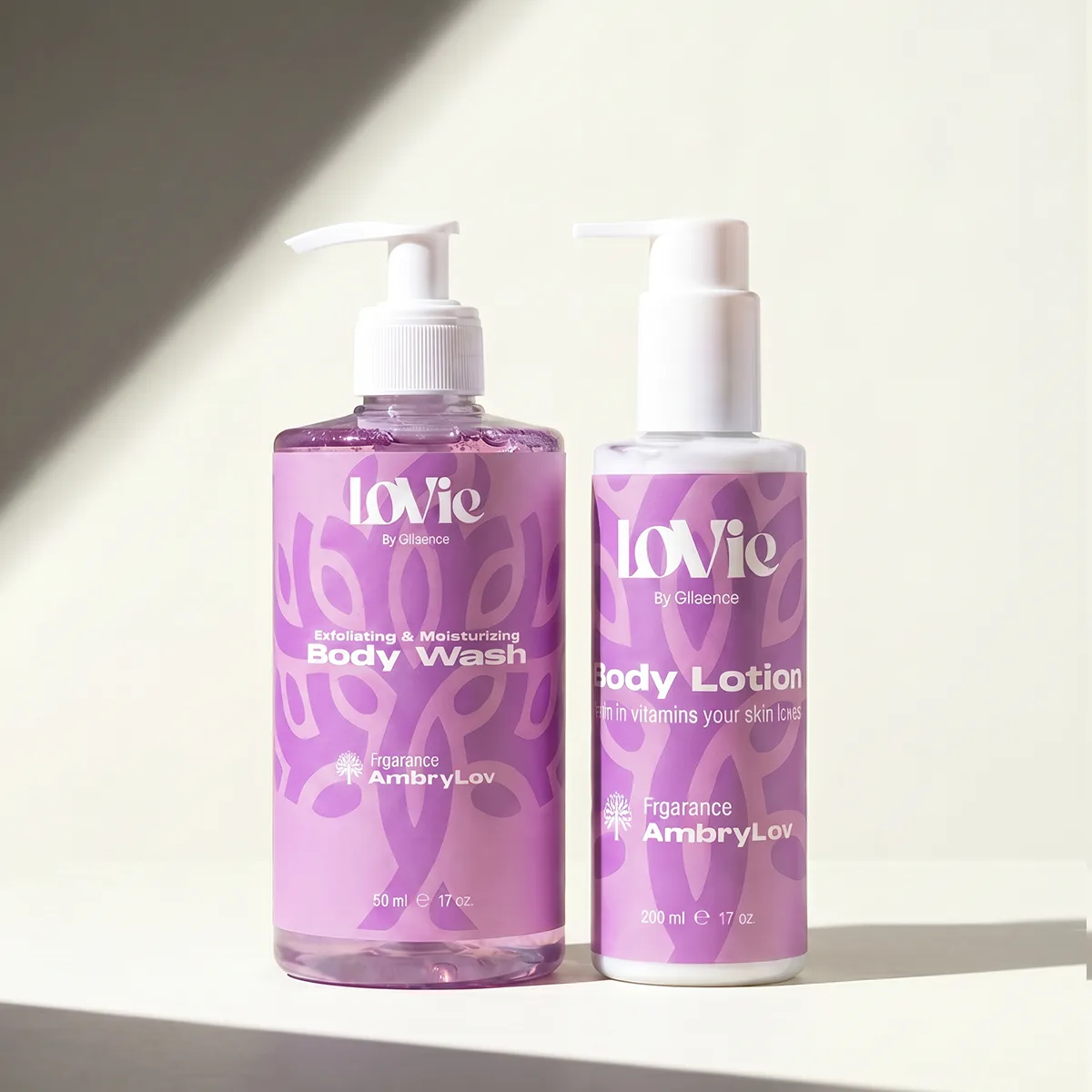 The violet AmbryLov body wash and body lotion in hard sunlight with a long shadow.