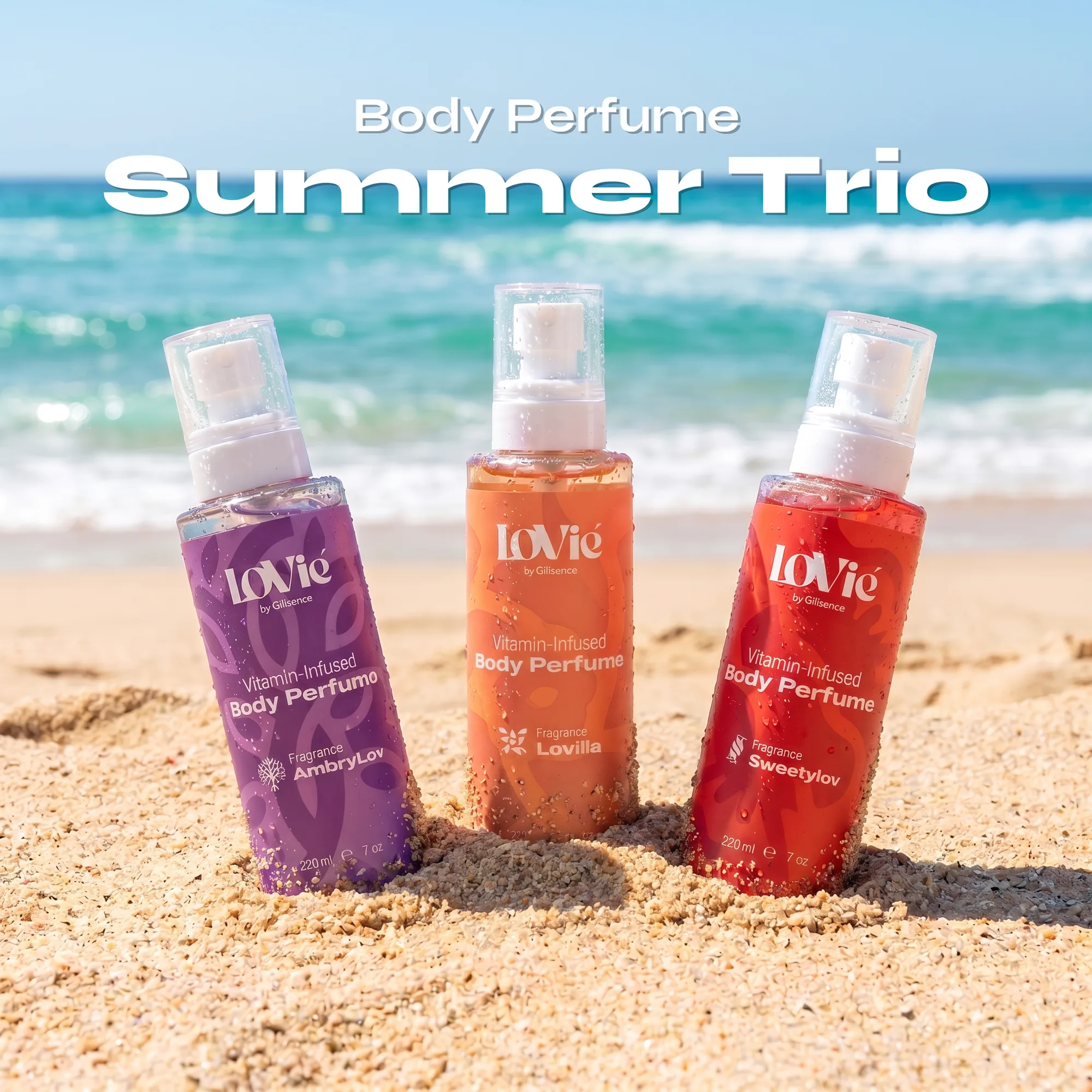 The three Lovie body perfumes standing in beach sand under the title Summer Trio.