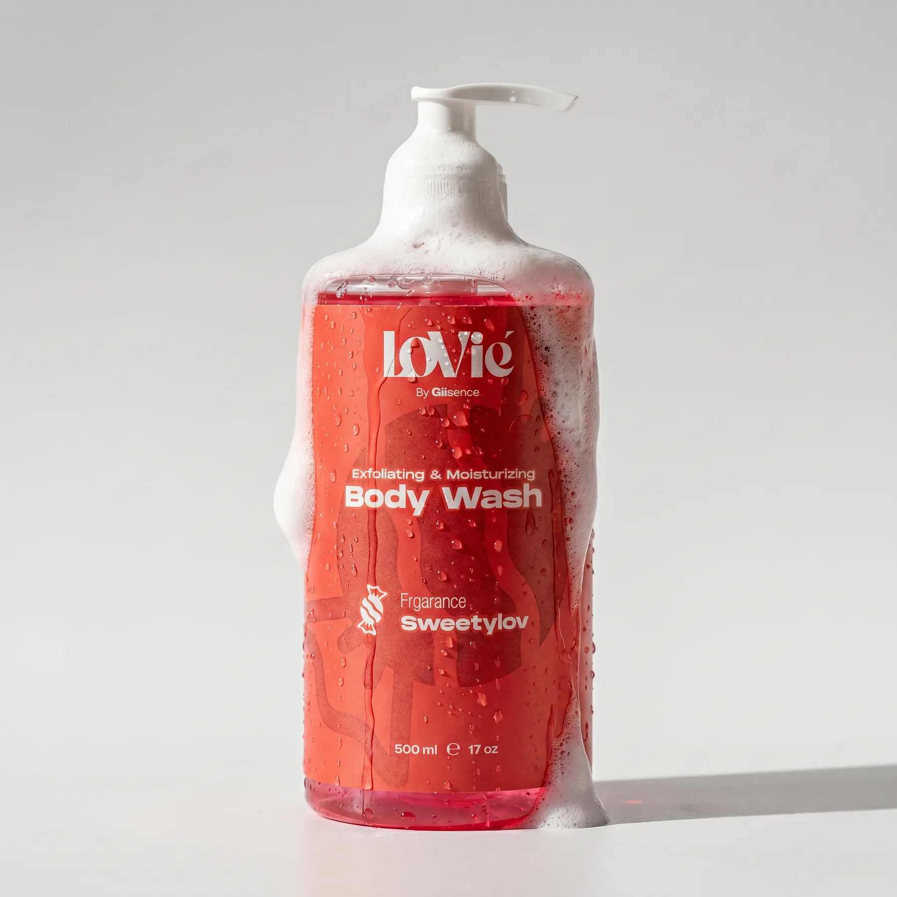 The scarlet Lovie body wash standing in foam on a white ground.