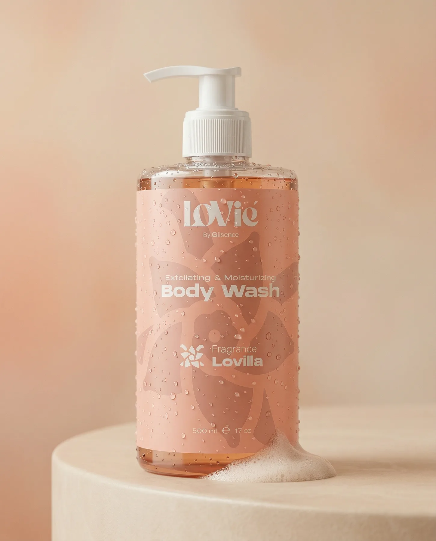The peach Lovilla body wash standing on a stone pedestal in warm light.