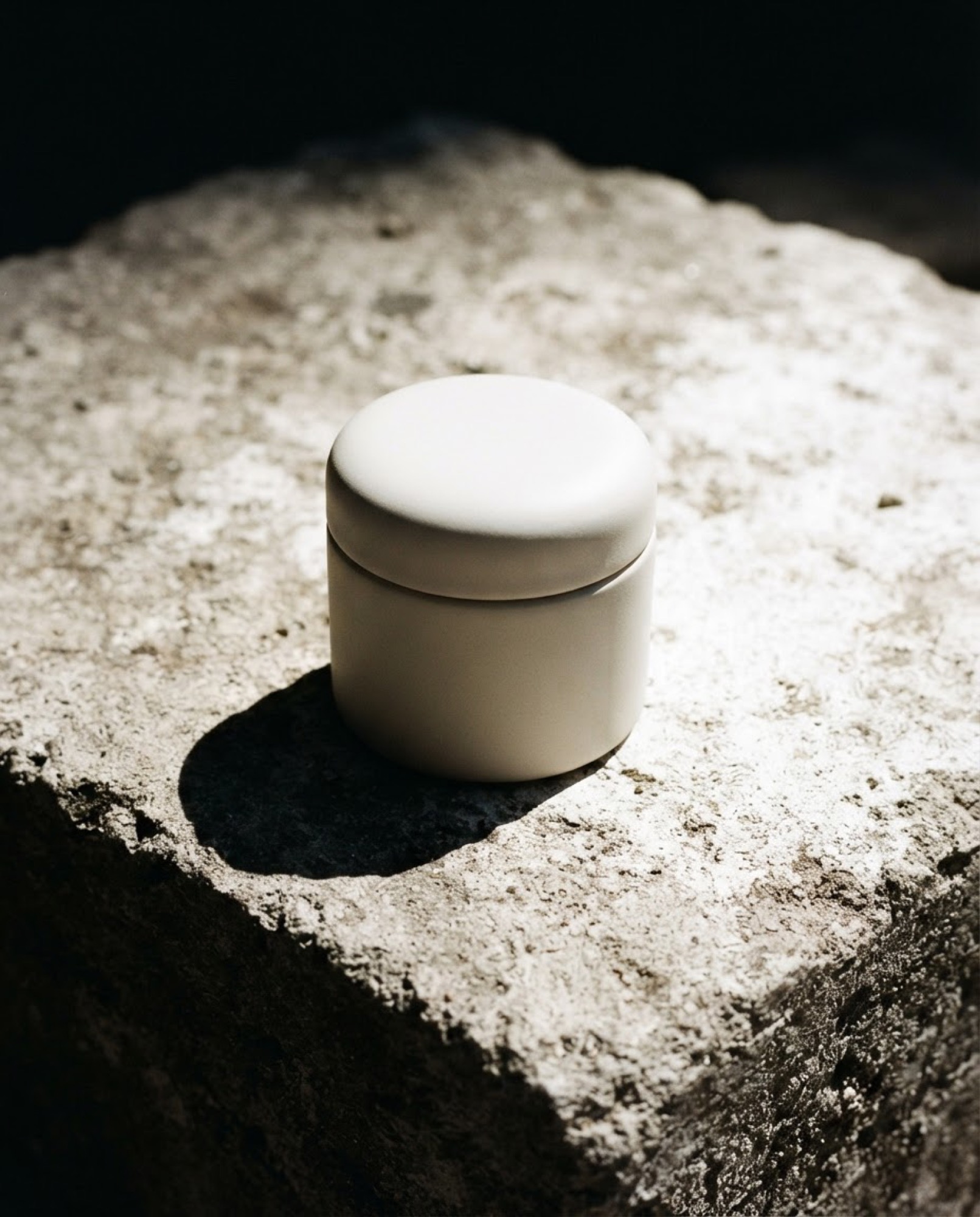 Unbranded vessel in harsh sunlight casting knife-edge shadows.
